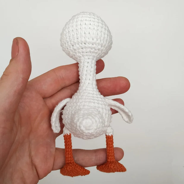 White goose  crochet pattern with christmas clothes