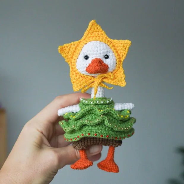White goose  crochet pattern with christmas clothes