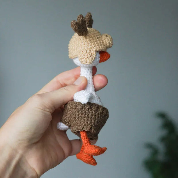 White goose  crochet pattern with christmas clothes