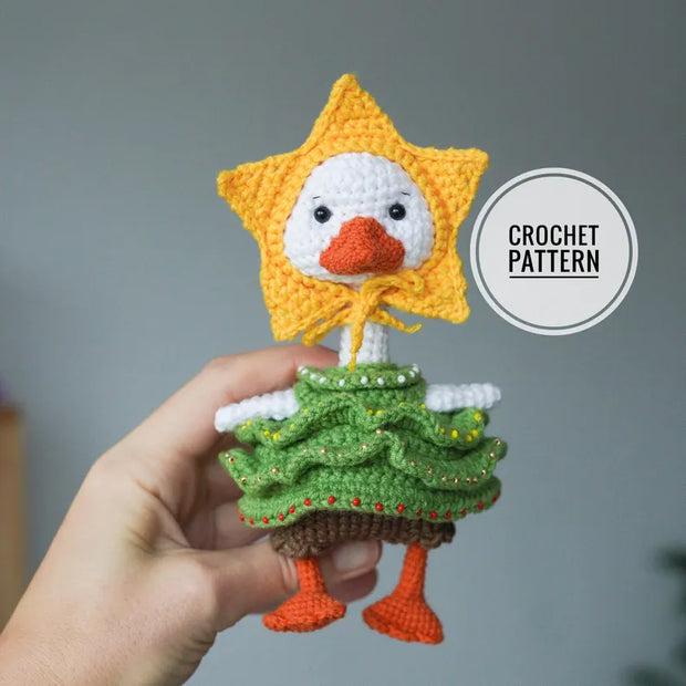 White goose  crochet pattern with christmas clothes