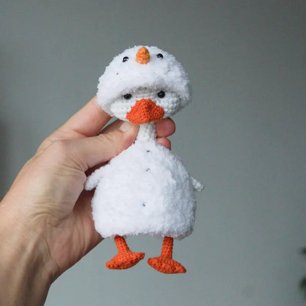 White goose  crochet pattern with christmas clothes