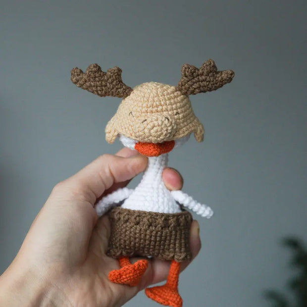 White goose  crochet pattern with christmas clothes